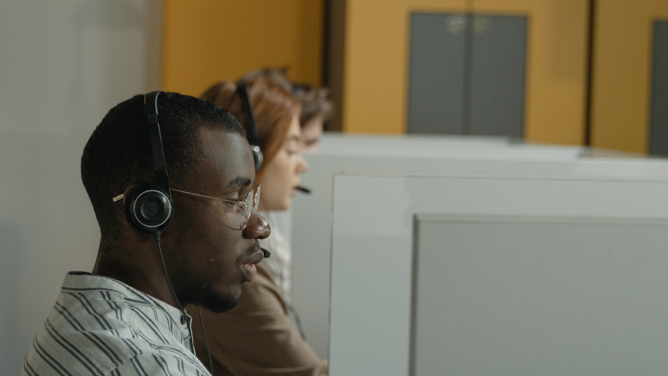 man headset infront of computer